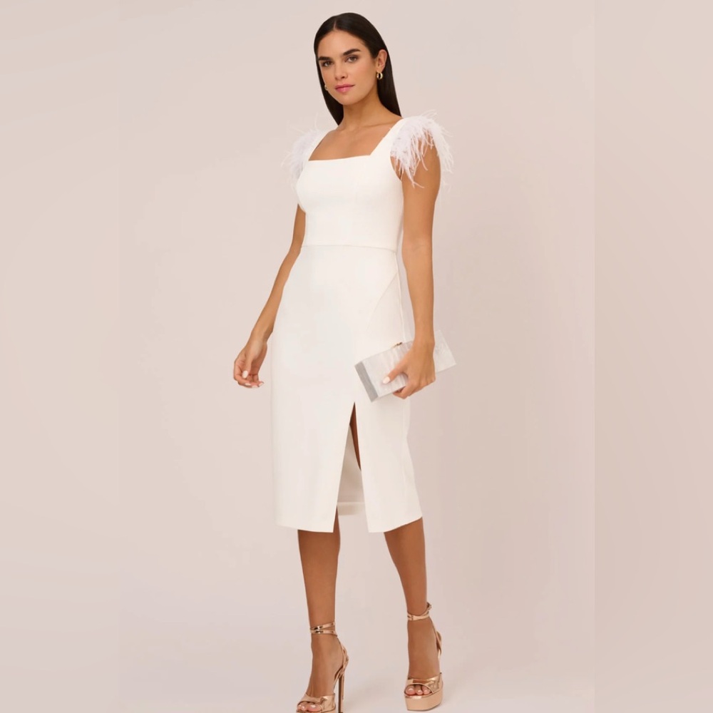 NEW WITH TAGS DRY CLEANED 
MIDI DRESS WITH FEATHER SHOULDER ACCENTS IN IVORY